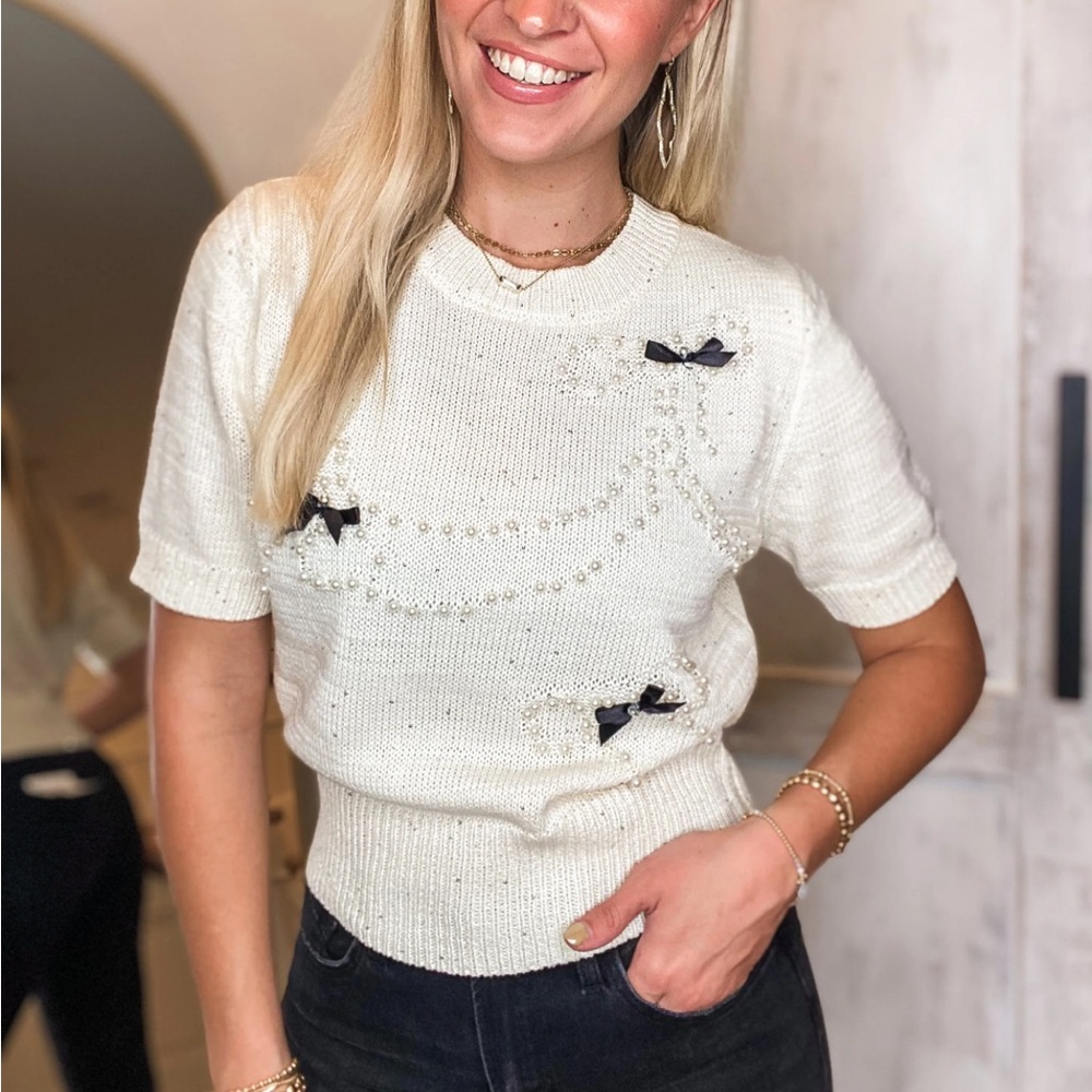 BEAUTY IN BOWS SWEATER